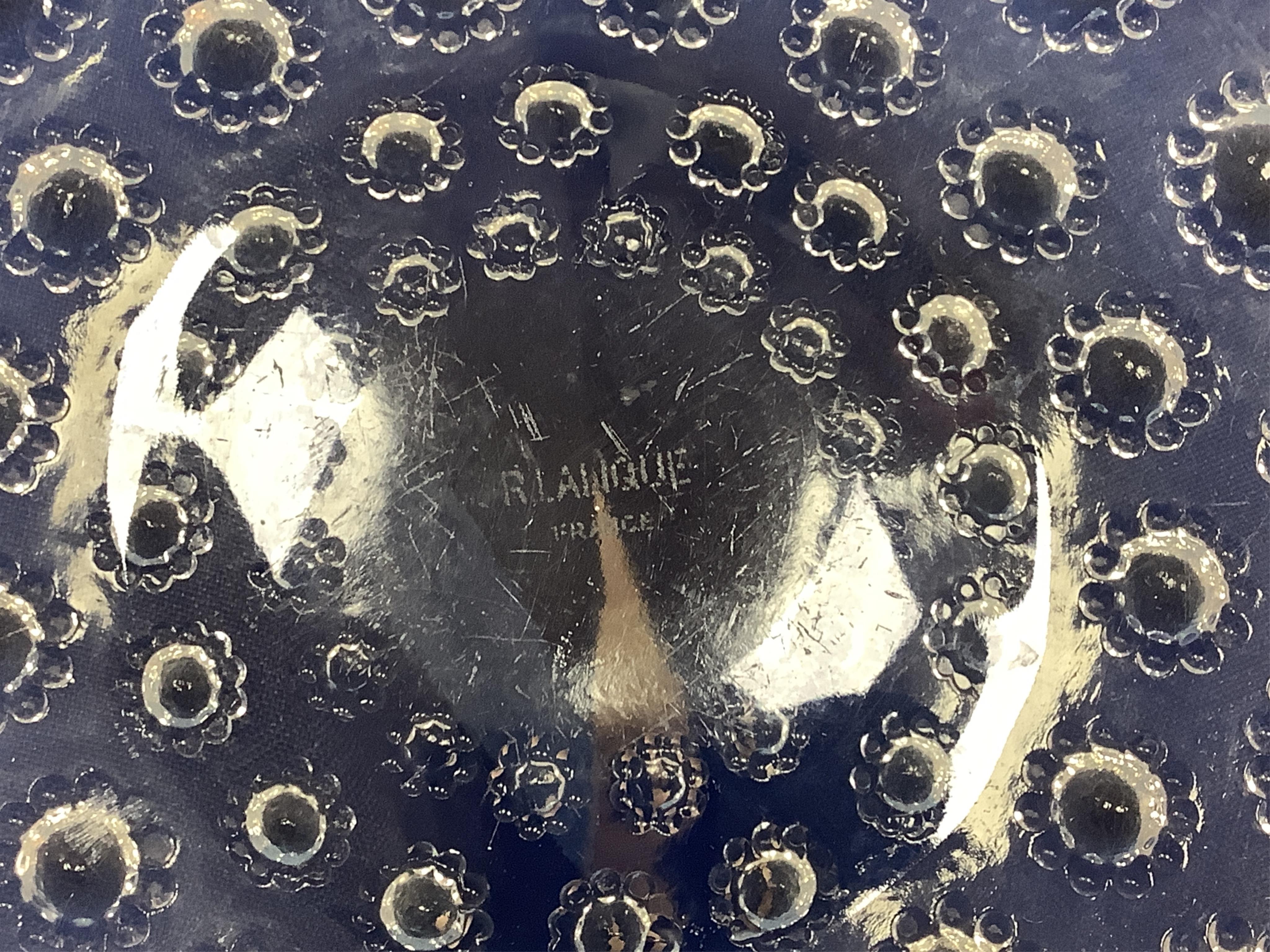 A Lalique Asters coupe-ouverte glass dish, etched R. Lalique France to the base, 28cm in diameter